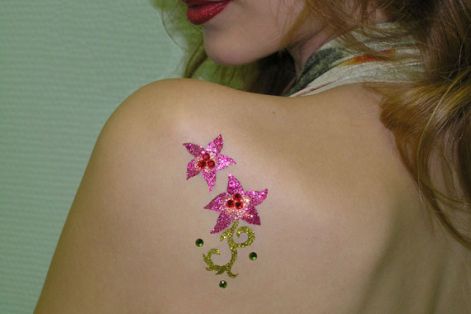 2_pink_flowers_and_1_gold_stalk_...glitter_tattoo_on_back.jpg